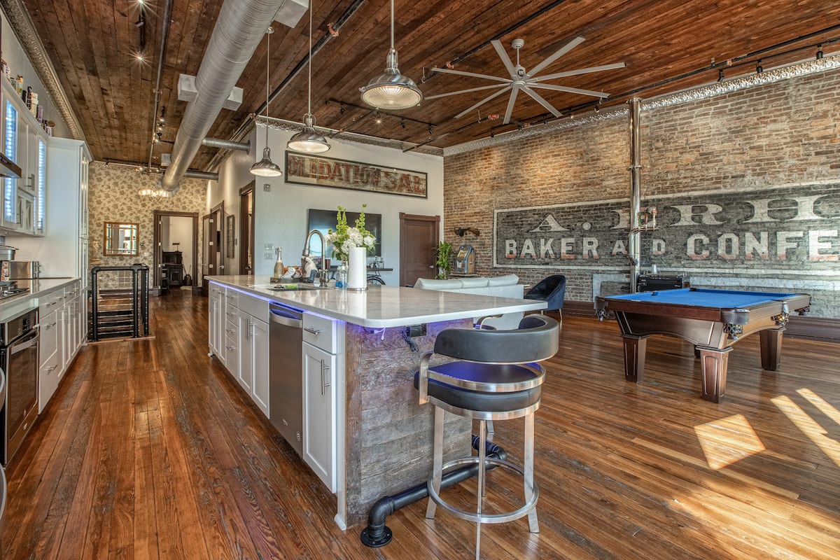 Kitchen island overlooking the pool table and great room