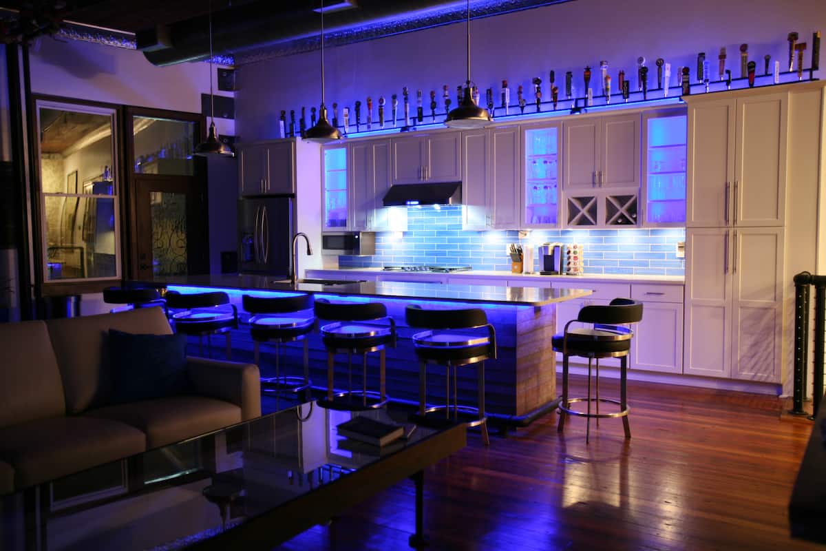 Kitchen and great room illuminated at night